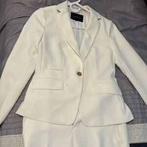 Off white suit like new